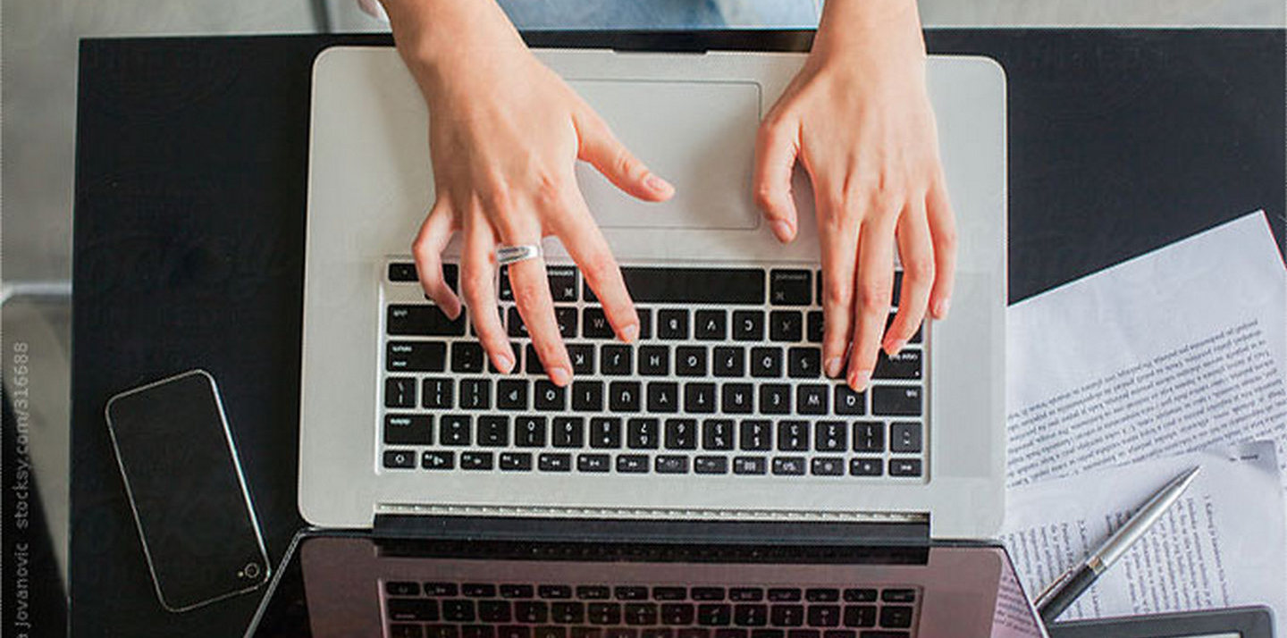 woman typing on computer